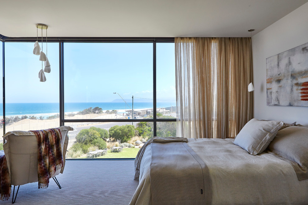 Design ideas for an expansive beach style bedroom in Melbourne.