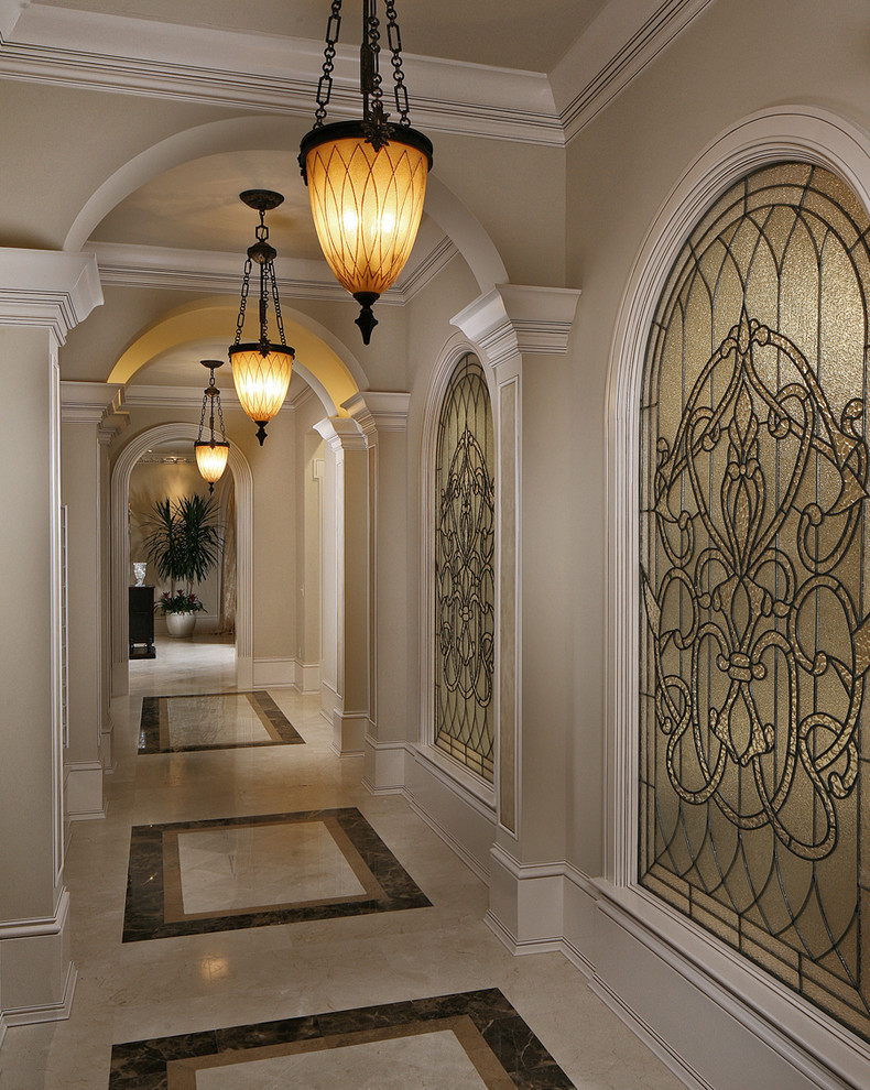 Design ideas for a traditional hallway in Miami with beige walls and multi-coloured floor.