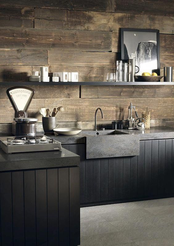 Inspiration for a small industrial l-shaped eat-in kitchen in Columbus with an integrated sink, flat-panel cabinets, black cabinets, concrete benchtops, brown splashback, timber splashback, stainless steel appliances, concrete floors, a peninsula, grey floor and grey benchtop.