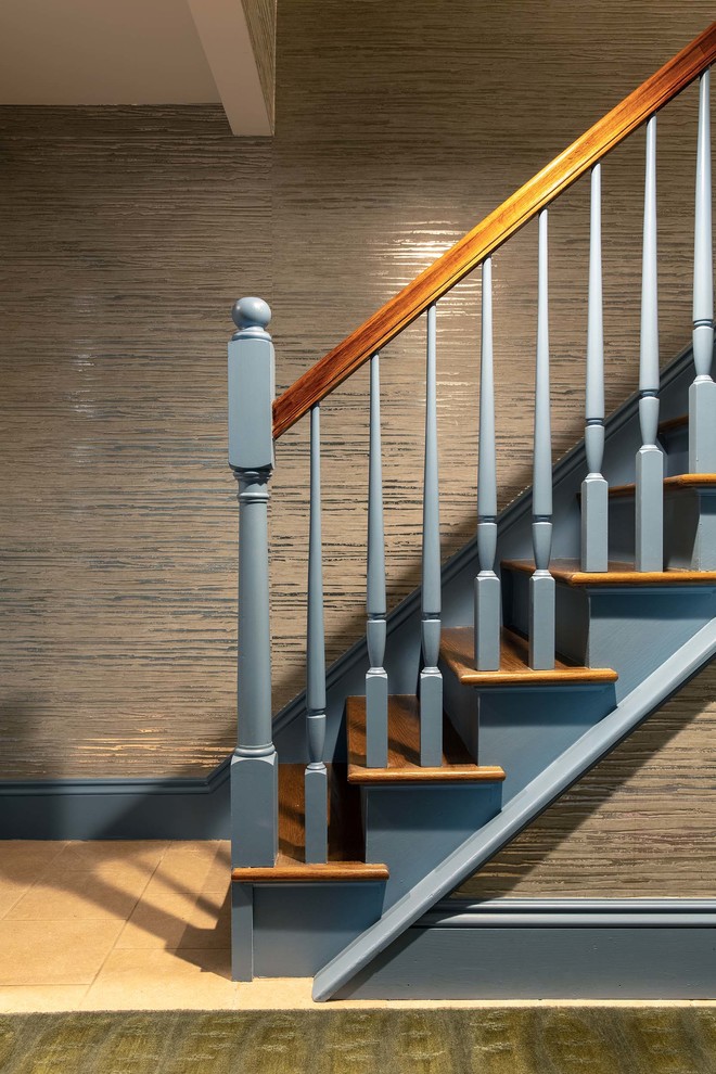 Inspiration for a mid-sized transitional wood straight staircase in Boston with wood risers and mixed railing.