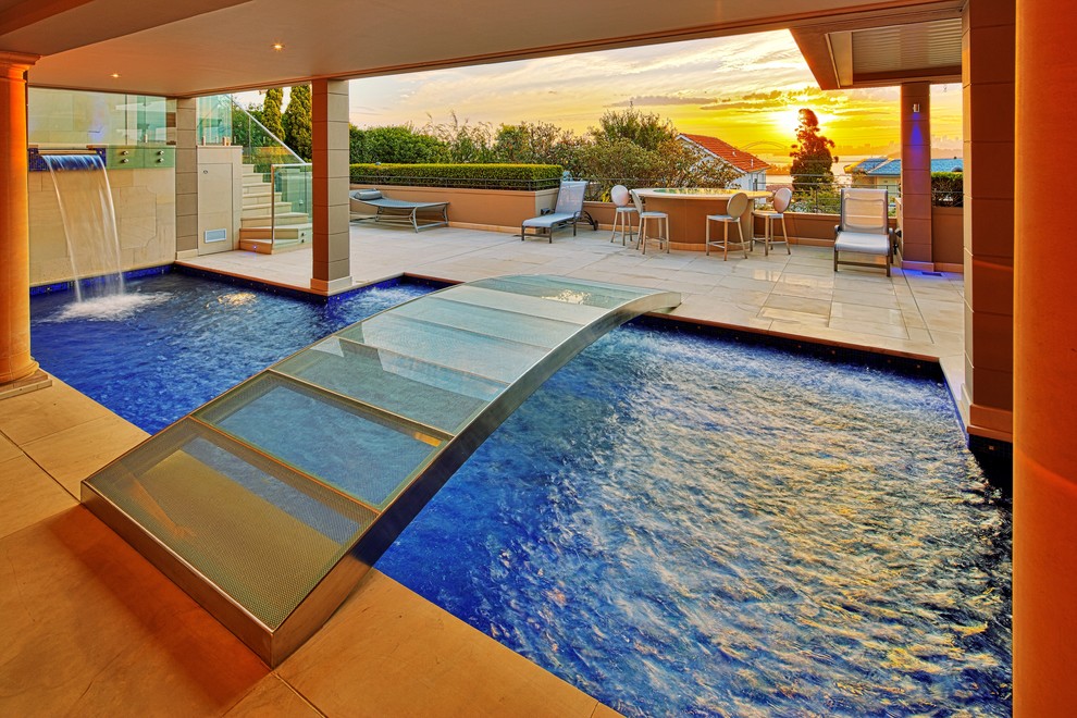 Design ideas for a contemporary custom-shaped pool in Sydney with a water feature.