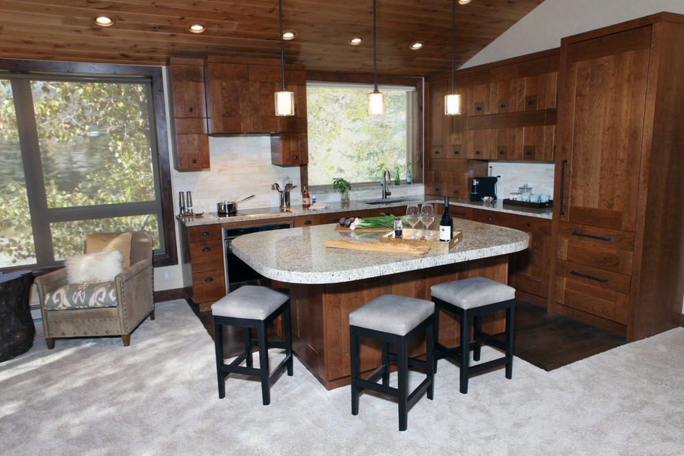 Example of a transitional l-shaped eat-in kitchen design in Denver with an undermount sink, shaker cabinets, medium tone wood cabinets, granite countertops, white backsplash, glass tile backsplash and paneled appliances