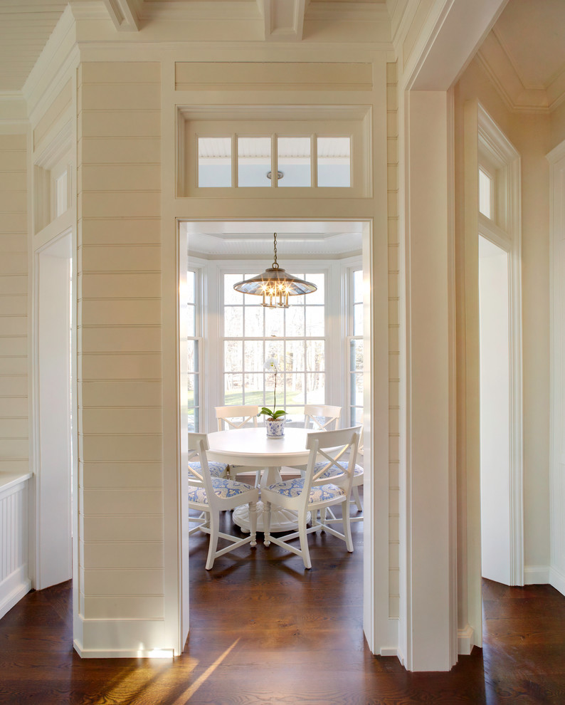 Inspiration for a traditional separate dining room in New York with beige walls, dark hardwood floors and no fireplace.