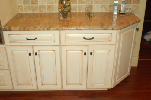 Large kitchen photo with white cabinets and granite countertops