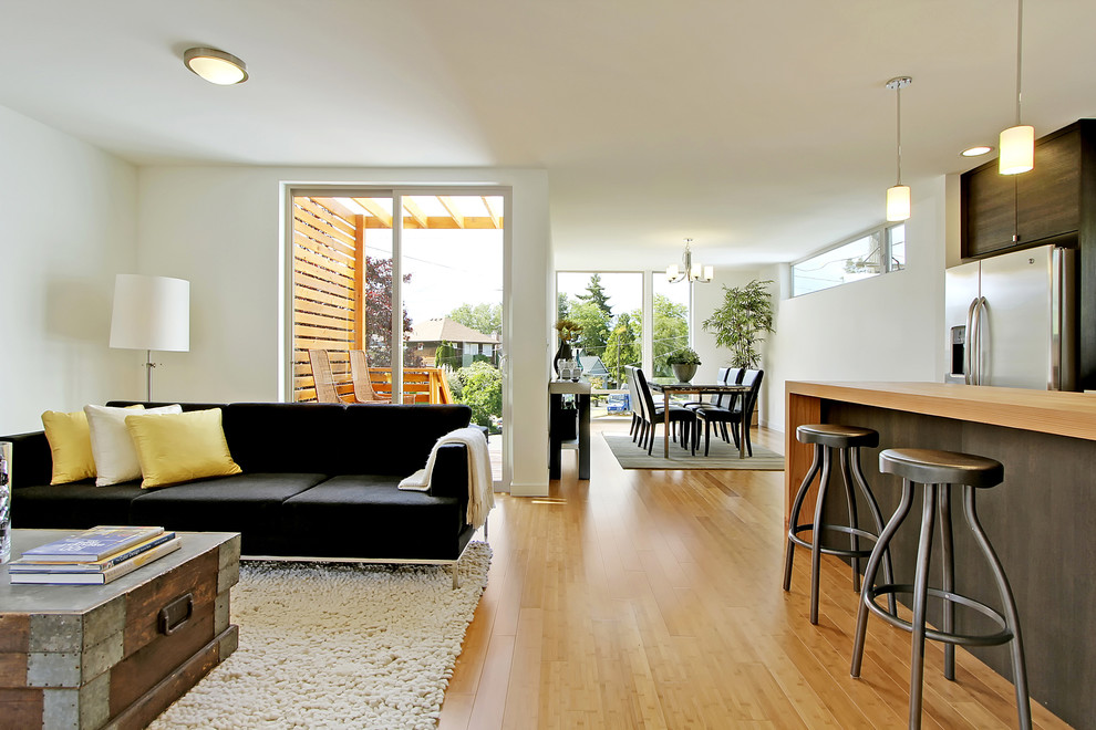 This is an example of a country living room in Seattle with white walls.