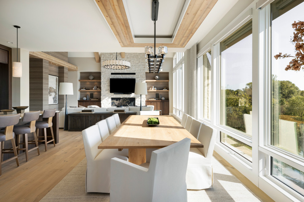 Great room - transitional light wood floor and beige floor great room idea in Minneapolis with gray walls