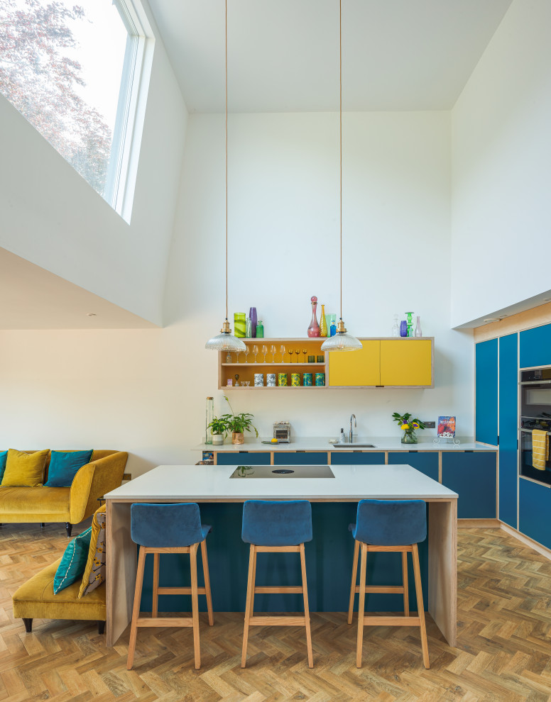 This is an example of a large modern l-shaped breakfast bar in Other with open cabinets and blue cabinets.
