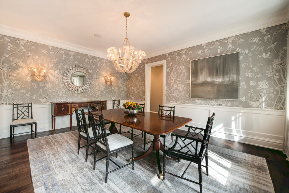 Enclosed dining room - large transitional medium tone wood floor and brown floor enclosed dining room idea with multicolored walls and no fireplace