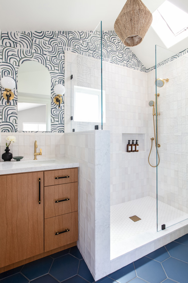 Design ideas for a contemporary bathroom in San Diego with light wood cabinets, an open shower, a one-piece toilet, white tile, porcelain tile, white walls, porcelain floors, an undermount sink, engineered quartz benchtops, blue floor, an open shower, a niche, a single vanity, a built-in vanity, vaulted and wallpaper.