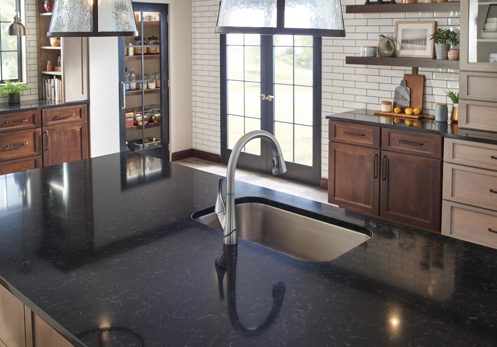 Enclosed kitchen - huge transitional l-shaped enclosed kitchen idea in Indianapolis with an undermount sink, shaker cabinets, distressed cabinets, quartz countertops, white backsplash, subway tile backsplash, an island and black countertops