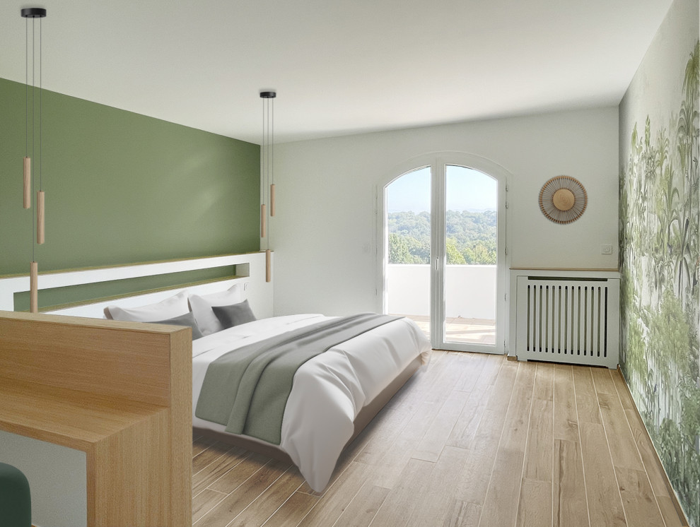 Foto di una grande camera da letto nordica con pareti verdi, parquet chiaro e carta da parati