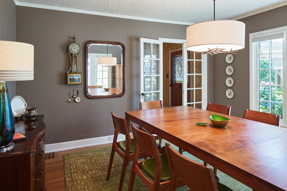Mid-sized eclectic separate dining room in Portland with purple walls and medium hardwood floors.