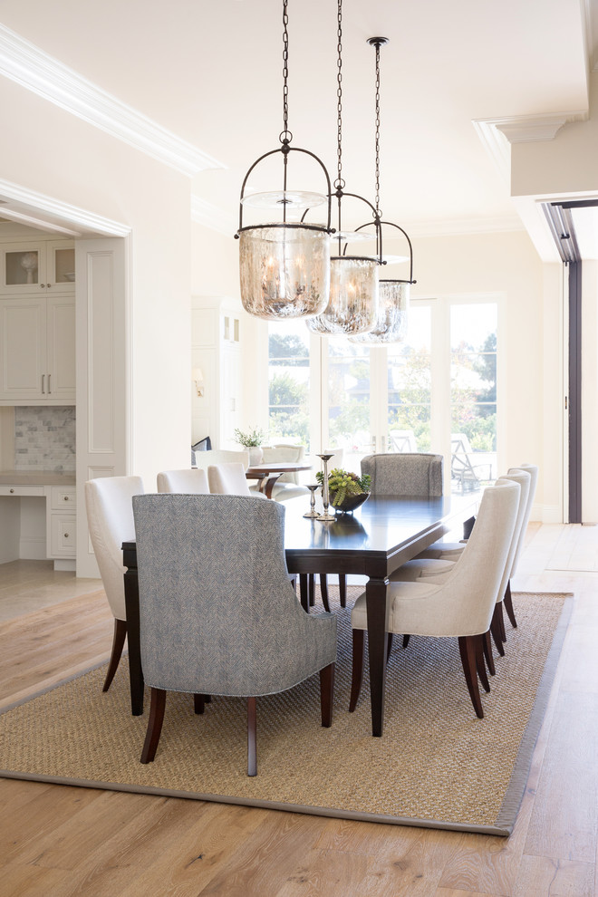 Design ideas for a mid-sized transitional open plan dining in San Diego with beige walls, medium hardwood floors and brown floor.