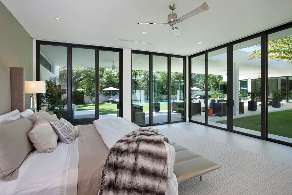 Contemporary bedroom in Miami with green walls.