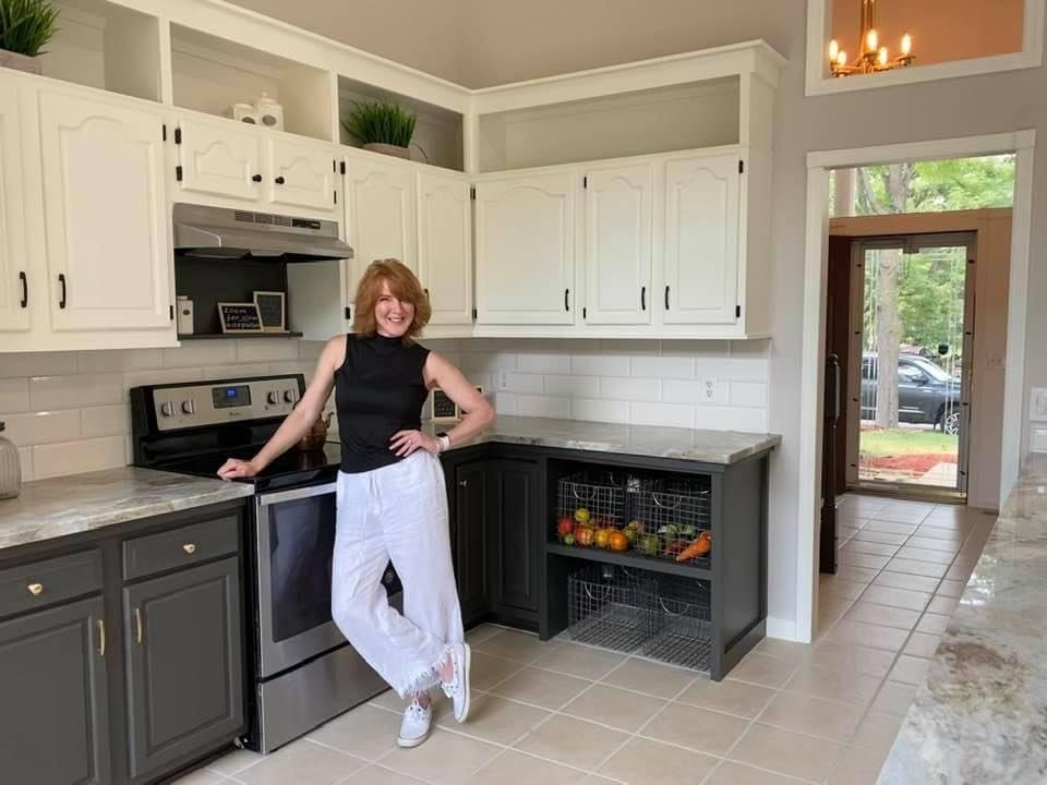 Photo of a mid-sized country galley eat-in kitchen in Minneapolis with a single-bowl sink, raised-panel cabinets, black cabinets, marble benchtops, white splashback, ceramic splashback, stainless steel appliances, ceramic floors, with island, beige floor, multi-coloured benchtop and vaulted.
