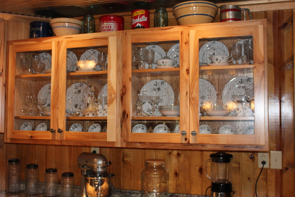 Inspiration for a mid-sized rustic l-shaped ceramic tile and brown floor eat-in kitchen remodel in Chicago with shaker cabinets, light wood cabinets, laminate countertops, an island, a double-bowl sink, brown backsplash, wood backsplash and stainless steel appliances