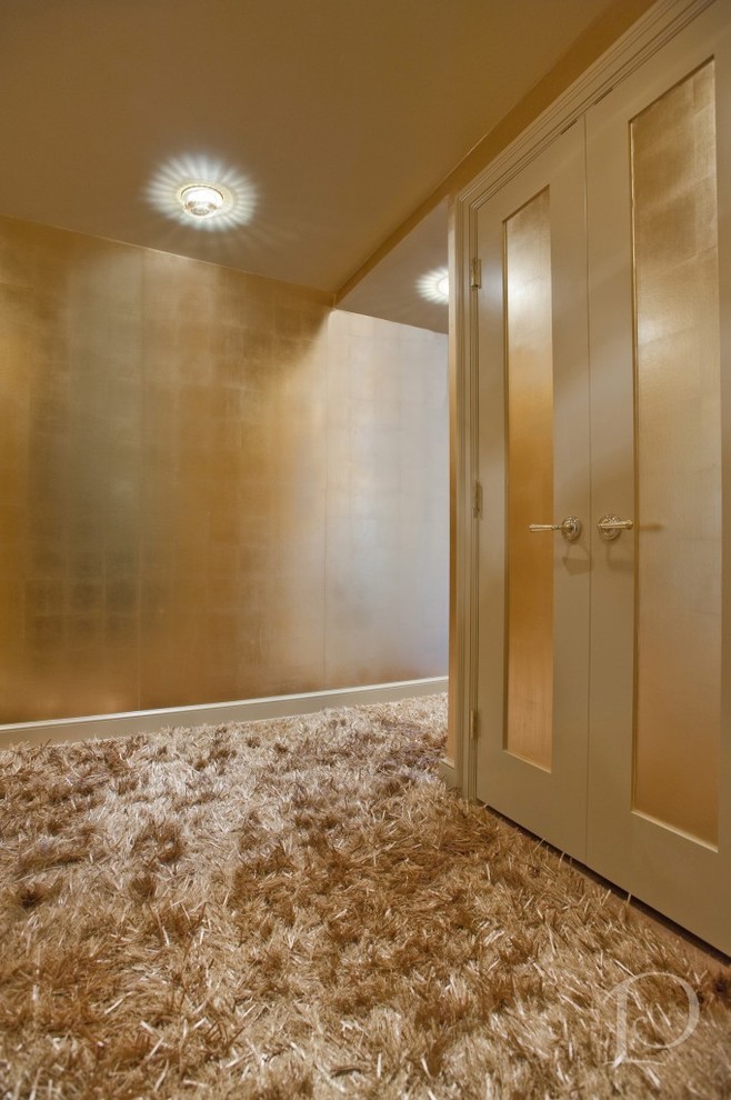 Photo of a contemporary foyer in Boston with metallic walls.