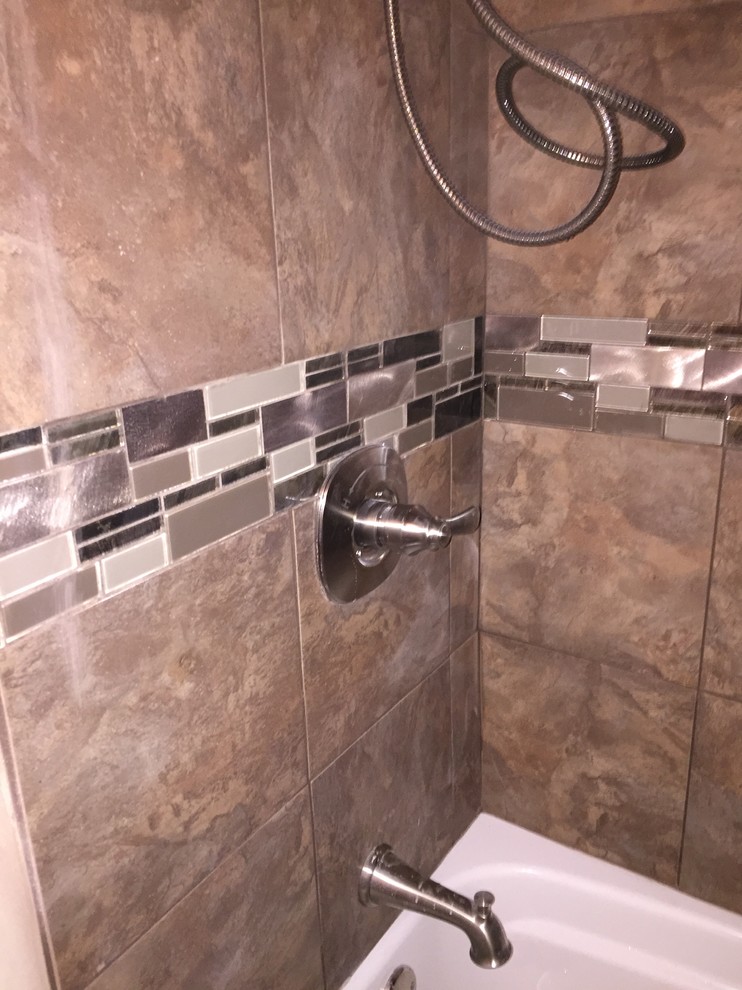 Example of a mid-sized transitional kids' brown tile and porcelain tile alcove bathtub design