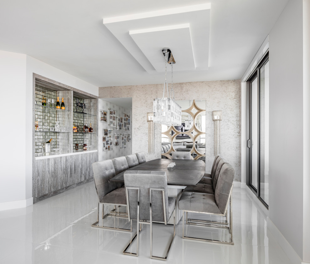 Transitional open plan dining in Miami with metallic walls, white floor and wallpaper.