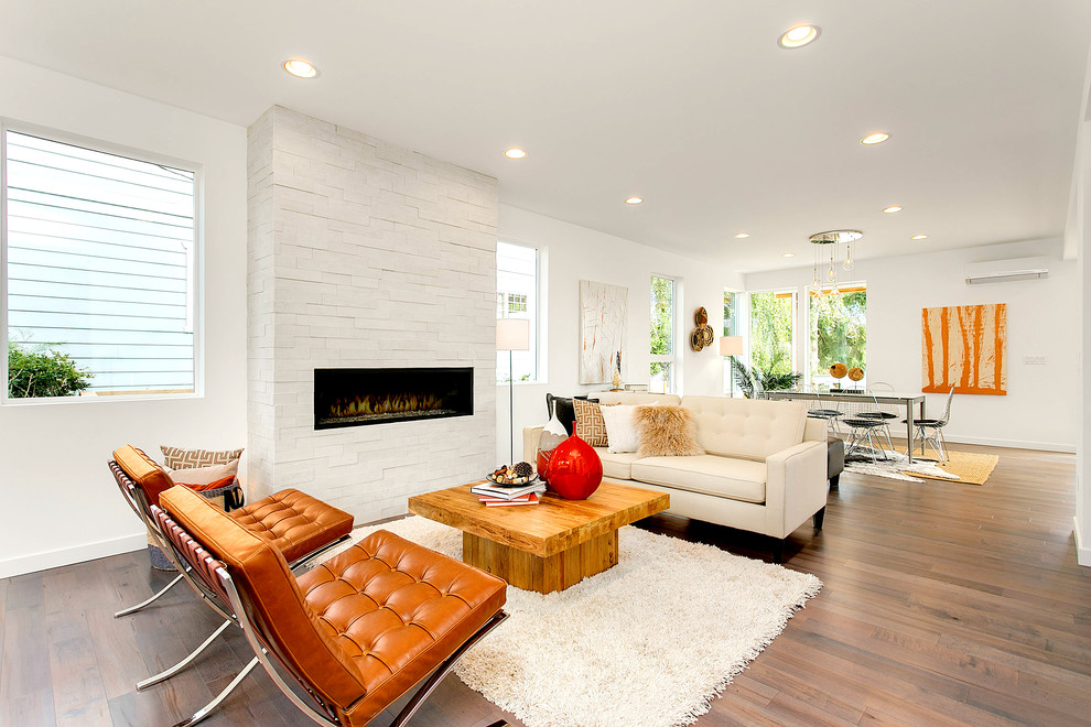 Mid-sized contemporary formal open concept living room in Seattle with white walls, light hardwood floors, a ribbon fireplace, a brick fireplace surround and no tv.