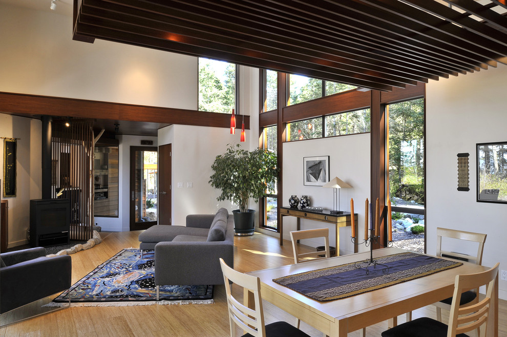 This is an example of an expansive contemporary living room in Seattle with white walls.
