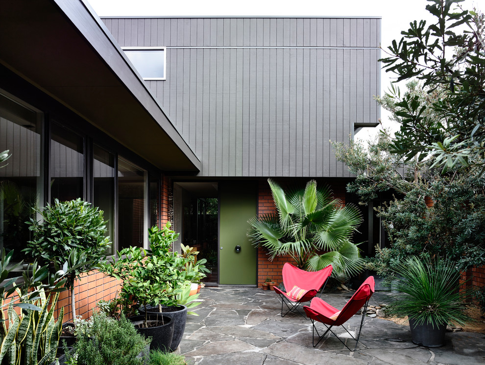 This is an example of a midcentury patio in Melbourne.