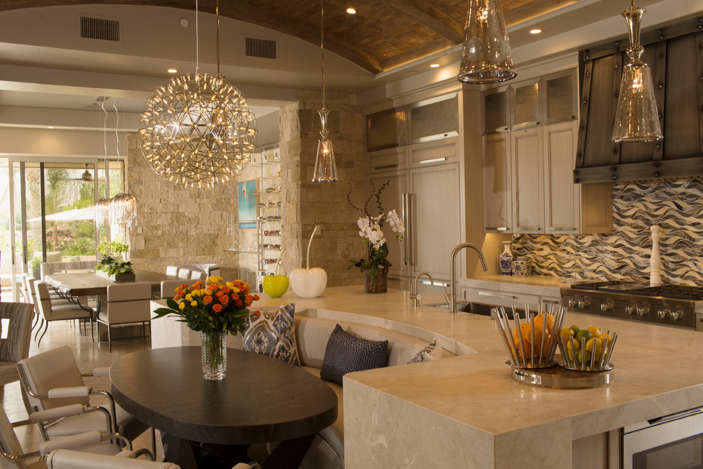 Inspiration for a large transitional l-shaped medium tone wood floor eat-in kitchen remodel with a drop-in sink, shaker cabinets, stainless steel cabinets, granite countertops, beige backsplash, ceramic backsplash, stainless steel appliances and an island