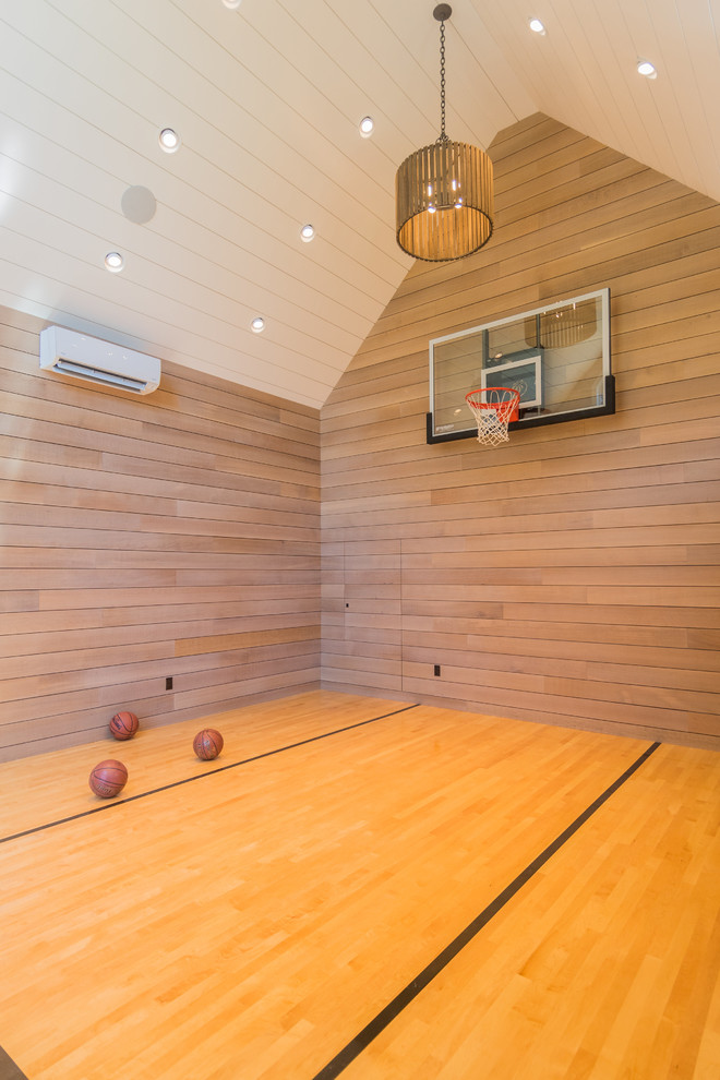 This is an example of a mid-sized transitional indoor sport court in Boston with medium hardwood floors.