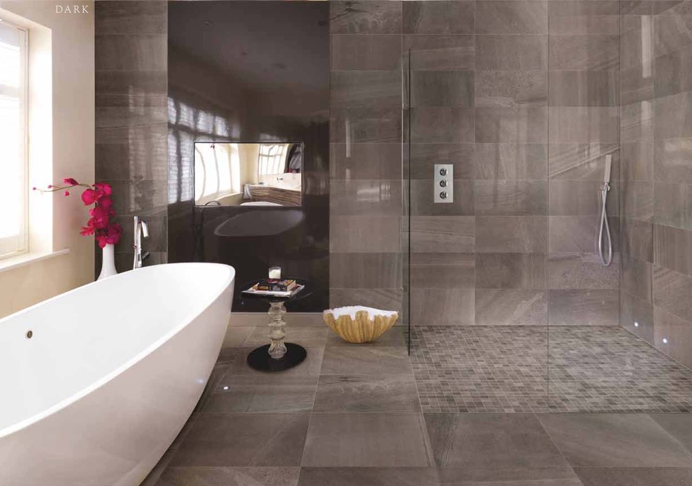 This is an example of a large modern bathroom in Miami with a freestanding tub, a curbless shower, gray tile, porcelain tile, grey walls and porcelain floors.