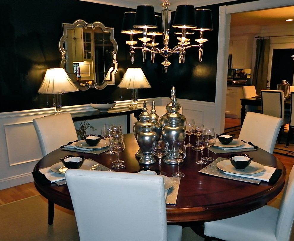 Example of a mid-sized transitional dark wood floor enclosed dining room design in Boston with black walls and no fireplace
