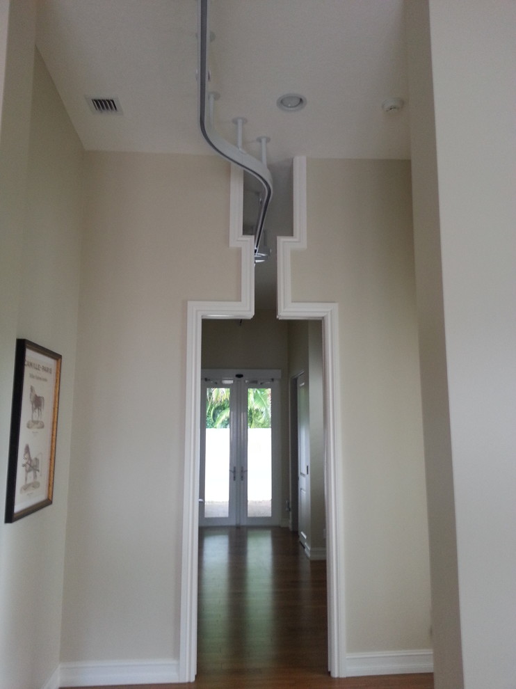 Hallway - transitional hallway idea in Miami
