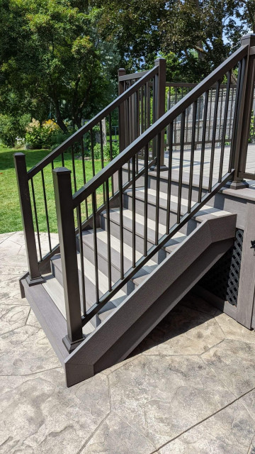 Azek PVC decking- Coastline & Dark Hickory with IRX railing and black lattice modern-terrace