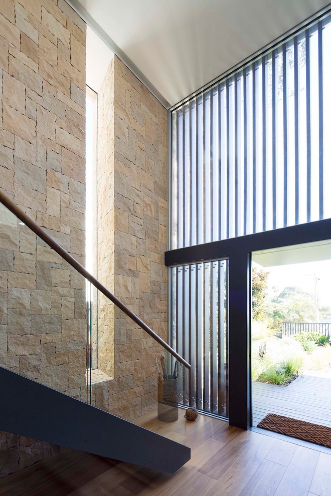 Design ideas for a large contemporary entryway in Sydney with a pivot front door and a metal front door.