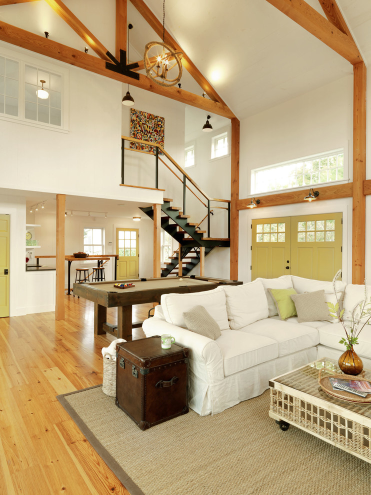 Inspiration for a large country open concept family room in Burlington with white walls and medium hardwood floors.