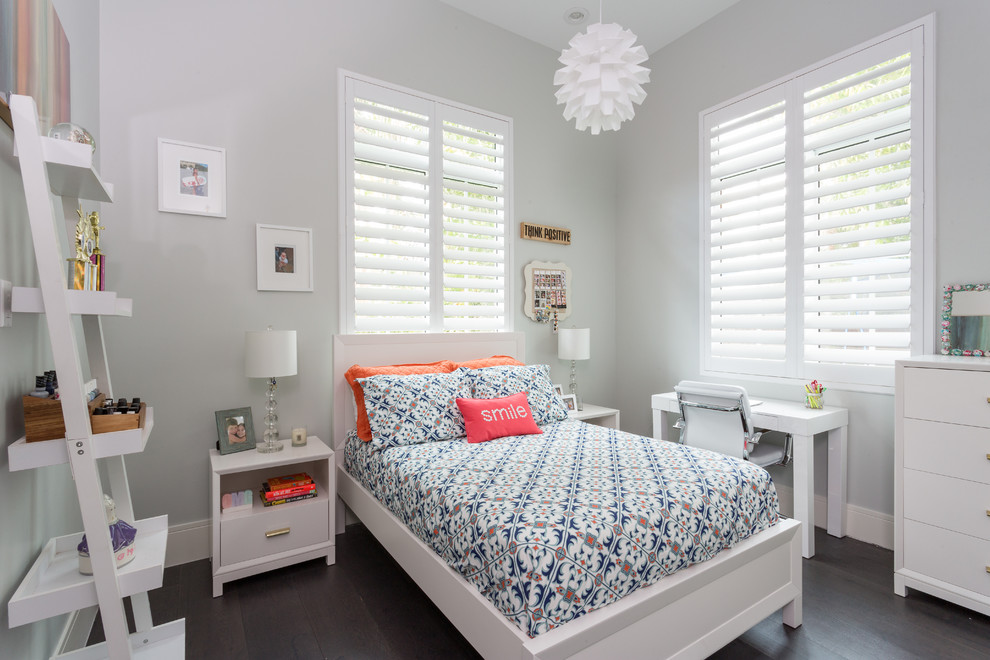 Mid-sized transitional kids' room in Miami with grey walls, dark hardwood floors and brown floor for girls.