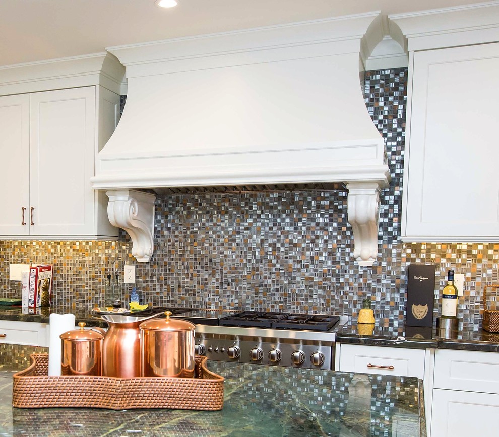 Large transitional u-shaped light wood floor open concept kitchen photo in Miami with a farmhouse sink, shaker cabinets, stainless steel appliances, an island, white cabinets, granite countertops, metallic backsplash and mosaic tile backsplash