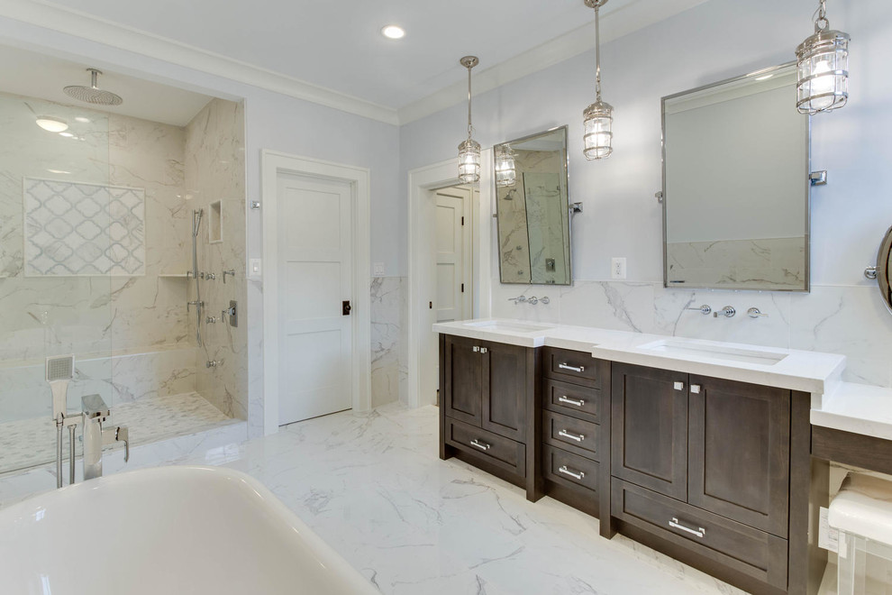 Photo of a large contemporary master bathroom in DC Metro with dark wood cabinets, a freestanding tub, an alcove shower, white walls, marble floors, an undermount sink, granite benchtops, white tile, shaker cabinets and stone tile.