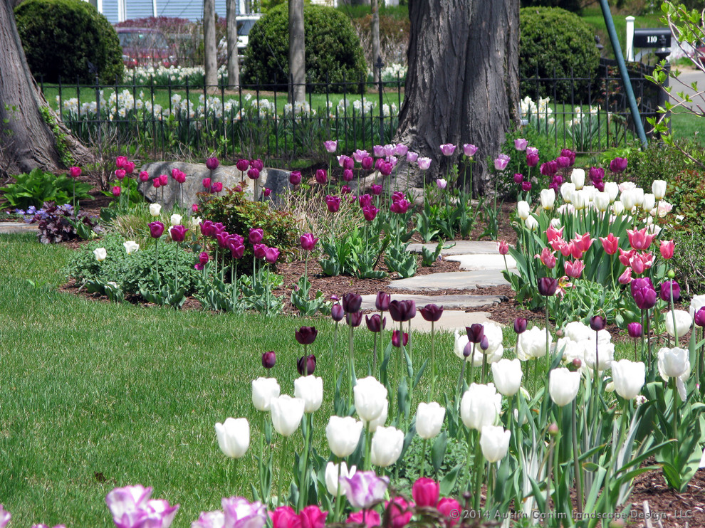 Design ideas for a traditional partial sun front yard stone landscaping in New York for spring.