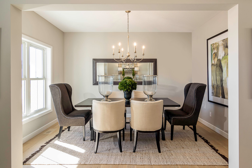 Mid-sized transitional separate dining room in Minneapolis with grey walls and light hardwood floors.