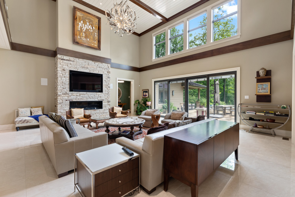 Inspiration for an expansive transitional open concept living room in Philadelphia with beige walls, a ribbon fireplace, a stone fireplace surround, a built-in media wall, white floor and timber.