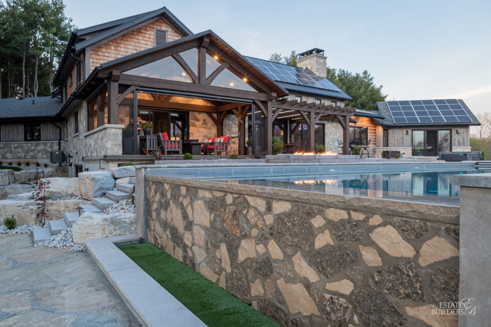 Inspiration for a rustic pool remodel in Toronto