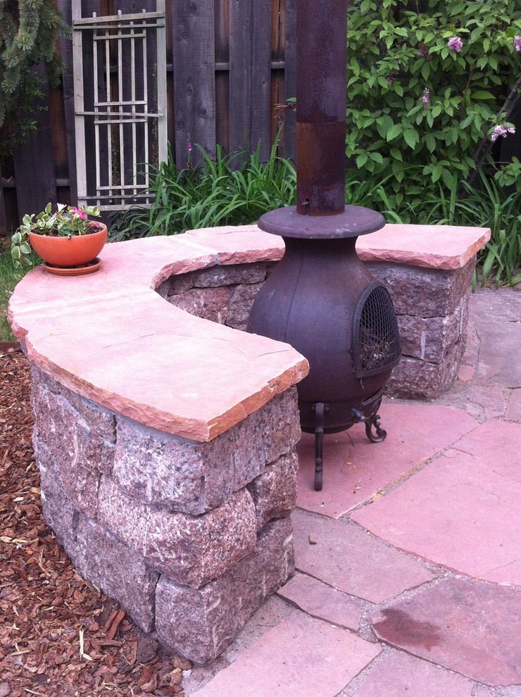 Patio - rustic backyard concrete paver patio idea in Albuquerque with a fire pit