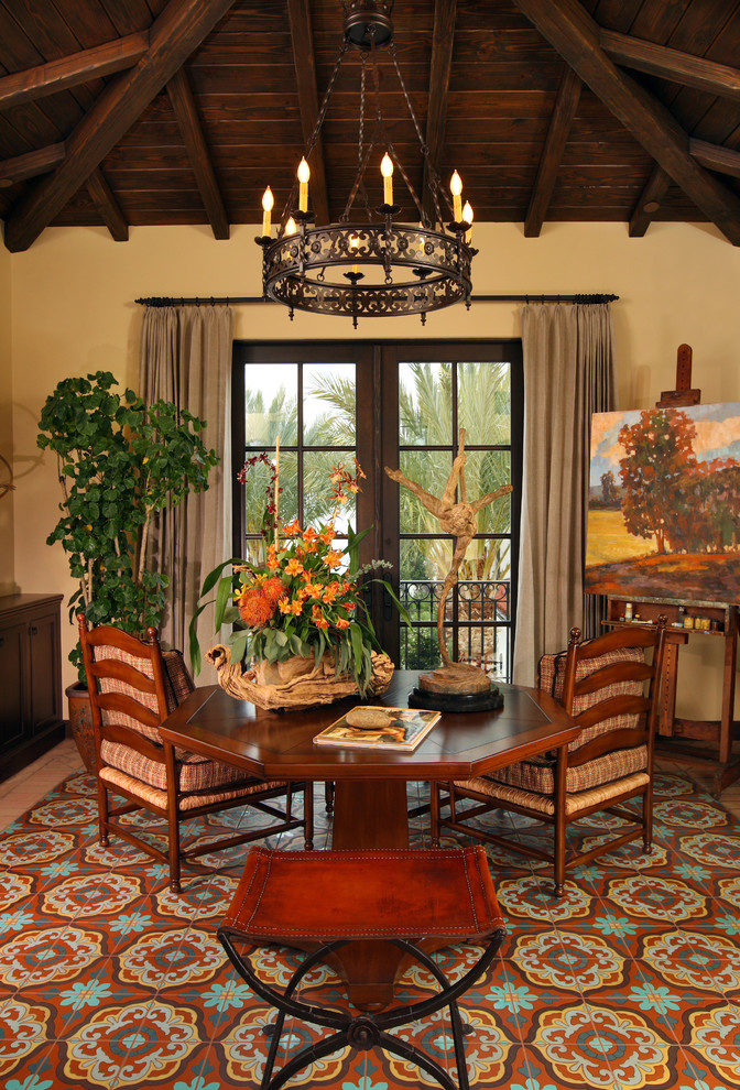 This is an example of a mediterranean family room in Orange County with beige walls and no tv.