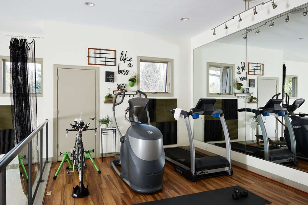 Inspiration for a mid-sized transitional home gym in Minneapolis with white walls and medium hardwood floors.
