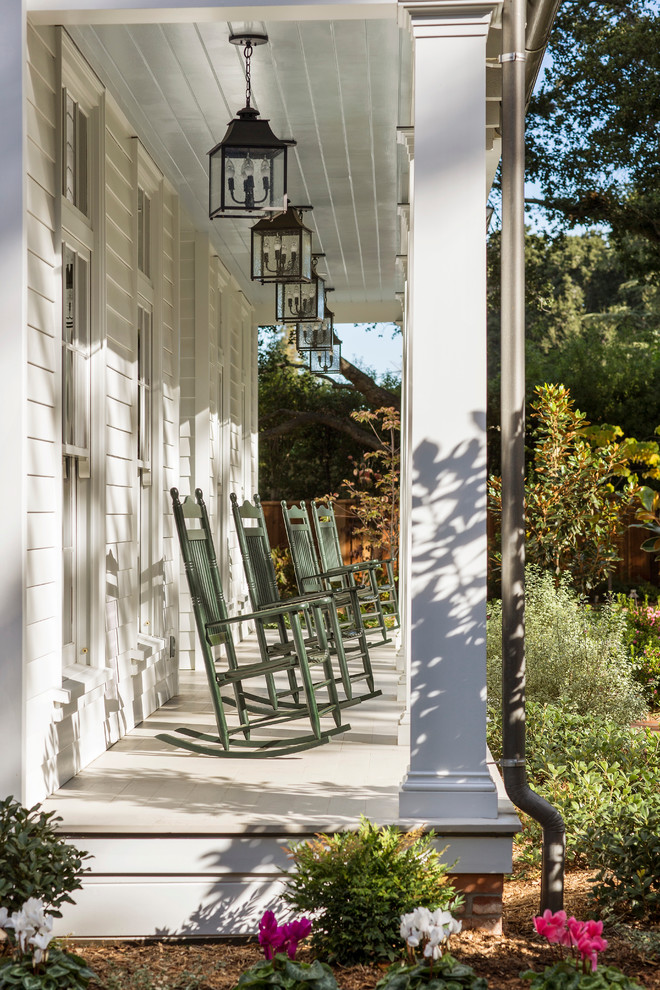 Atherton Residence - Example of a mid-sized classic backyard concrete patio design in San Francisco with a roof extension