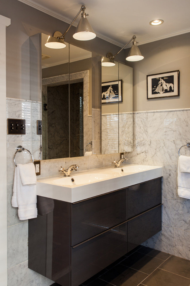 This is an example of a small eclectic master bathroom in Philadelphia with flat-panel cabinets and white cabinets.