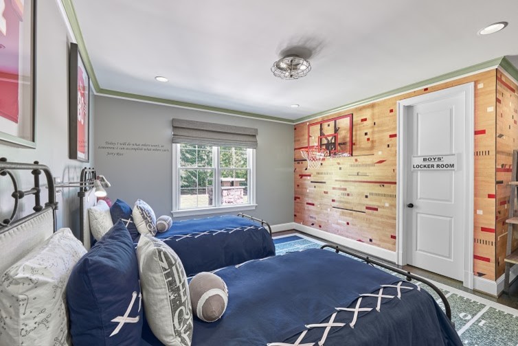 Photo of a mid-sized transitional kids' room for boys in DC Metro with grey walls, medium hardwood floors and brown floor.
