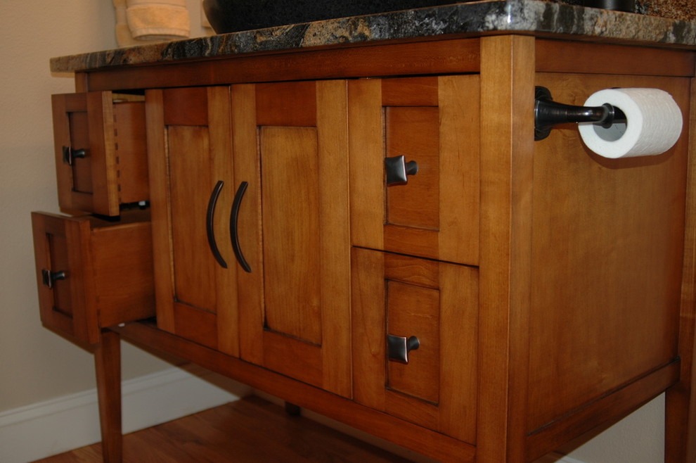 Example of a mid-sized 3/4 medium tone wood floor bathroom design in Denver with a vessel sink, medium tone wood cabinets, quartzite countertops and beige walls