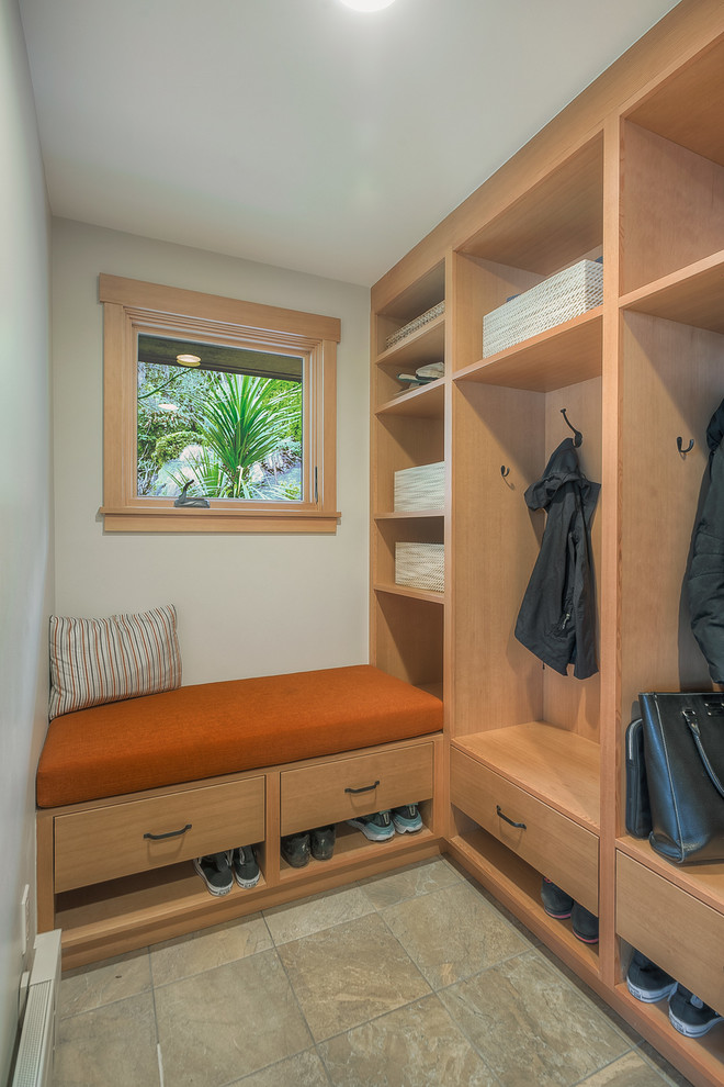 Mid-sized transitional storage and wardrobe in Seattle with flat-panel cabinets, light wood cabinets, slate floors and grey floor.