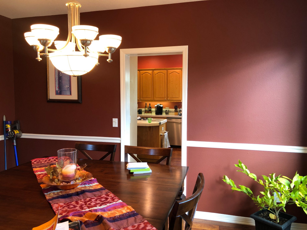 Photo of a mid-sized traditional separate dining room in Portland with purple walls, dark hardwood floors and brown floor.